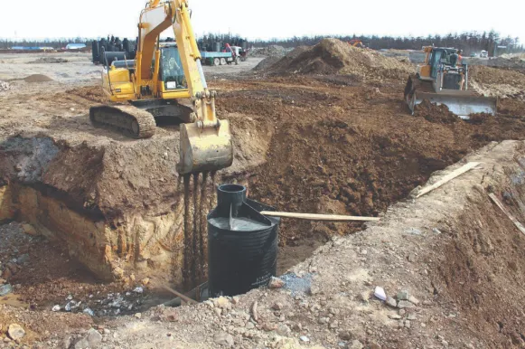 Робочий процес засипки котловану